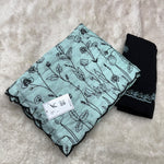 Vichitra silk with floral print and contrast black border(self)